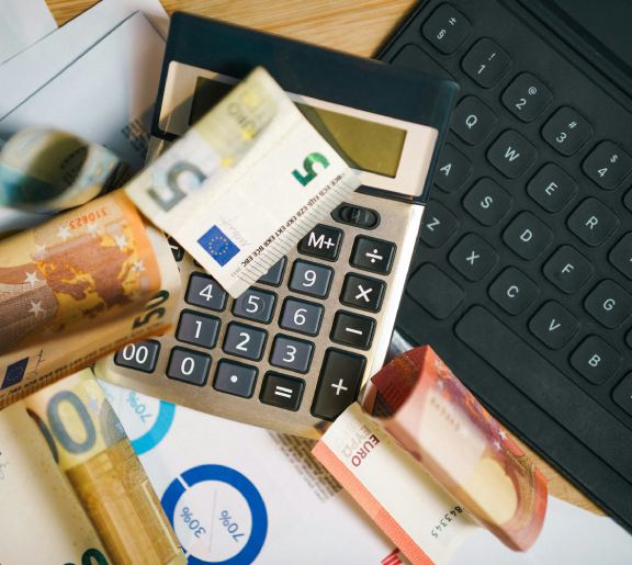 Calculator on a pile of money